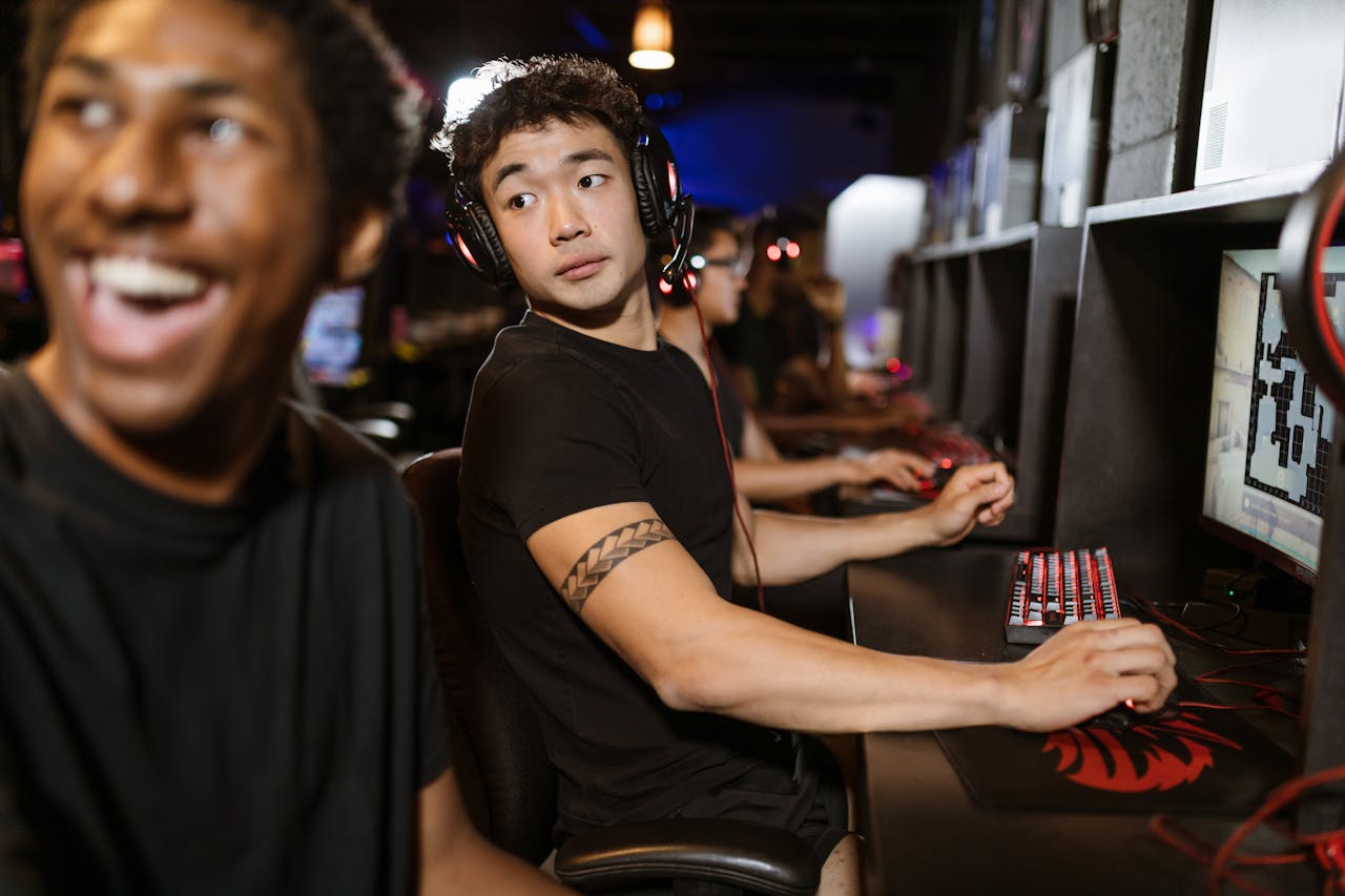 Offerings Young gamers engaged in a multiplayer session at an eSports arena with high-end gaming setups.